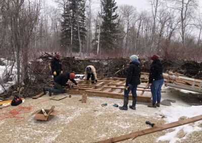 Volunteers working to construct the Veterans' Rest Area platform at the end of the boardwalk.